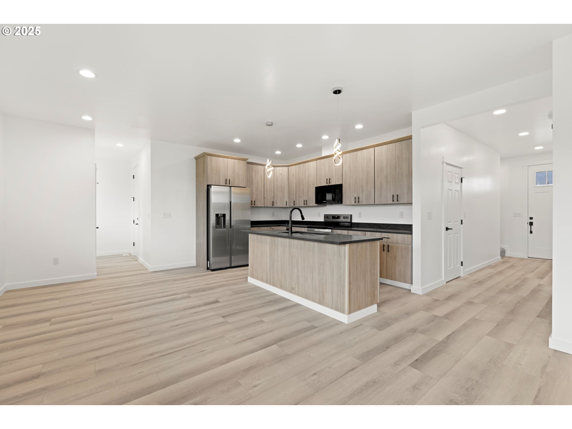240 Heritage Lane Union, OR 97883 - Photo 12 of 36 a view of kitchen with granite countertop refrigerator and white cabinets