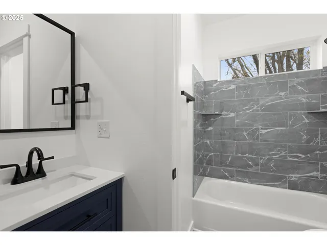 a bathroom with a sink and a bathtub