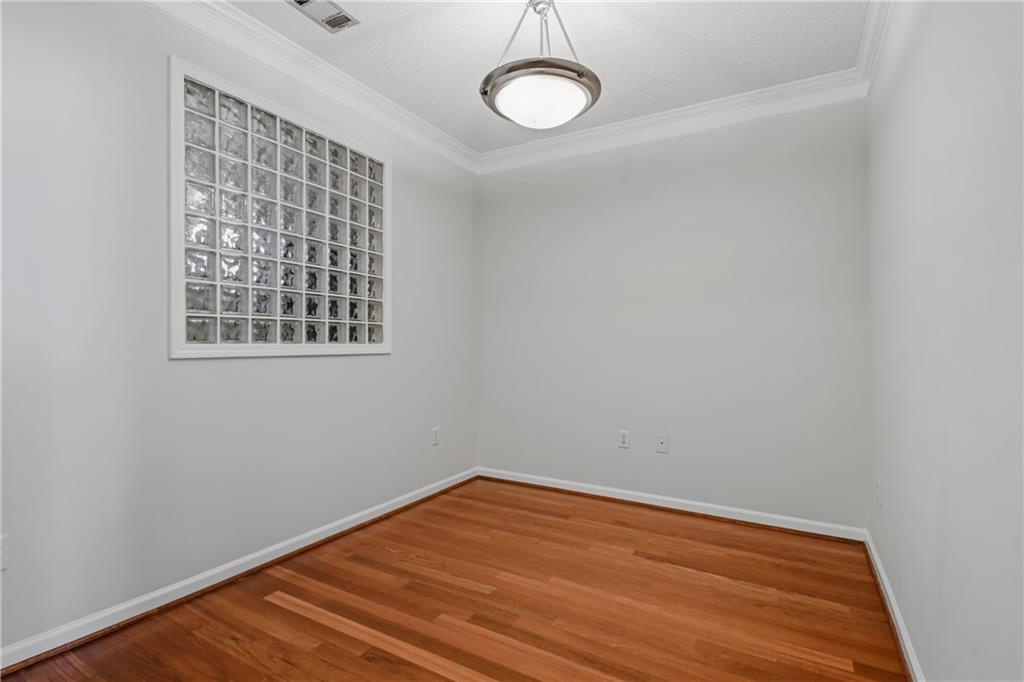10 Perimeter Summit Boulevard, Unit 3311 Atlanta, GA 30319 - Photo 48 of 68 a view of a room with wooden floor and white walls