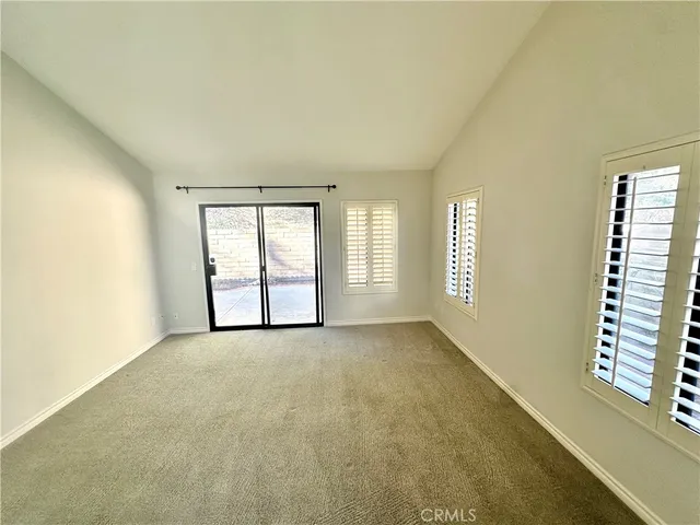 an empty room with a mirror