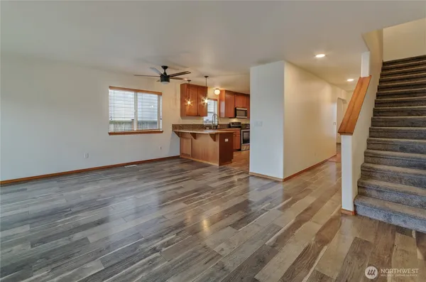 a view of a kitchen with a sink and microwave