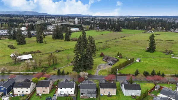 an aerial view of a houses with outdoor space