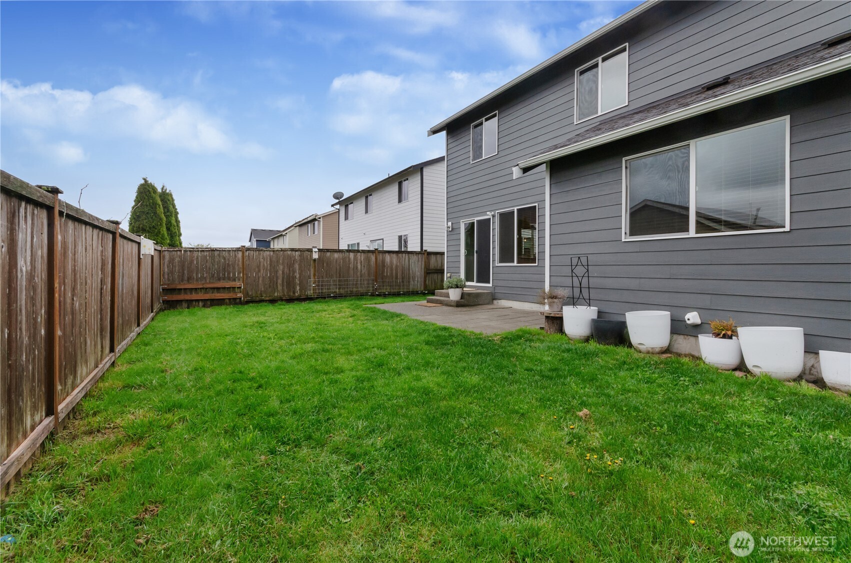 9114 Canal Road Southeast Yelm, WA 98597 - Photo 31 of 40 a front view of a house with garden