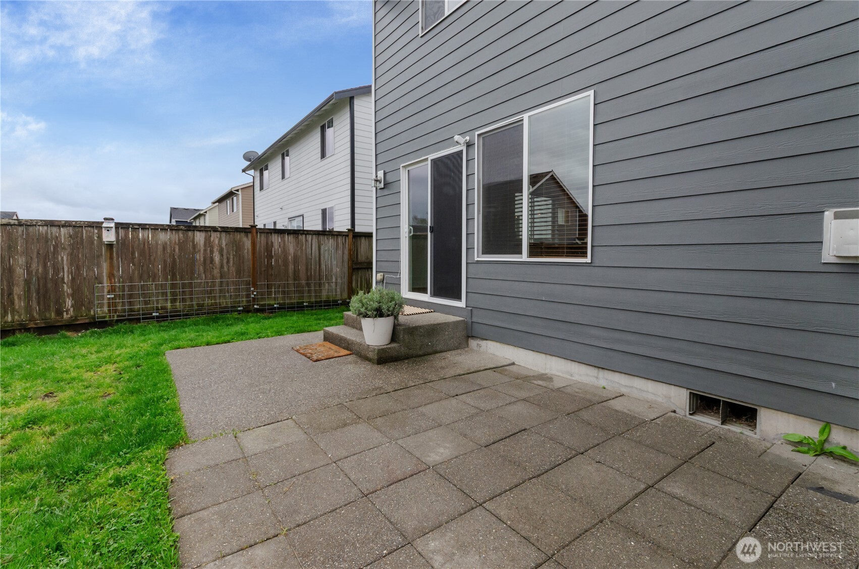 9114 Canal Road Southeast Yelm, WA 98597 - Photo 34 of 40 a view of a house with backyard and a chair