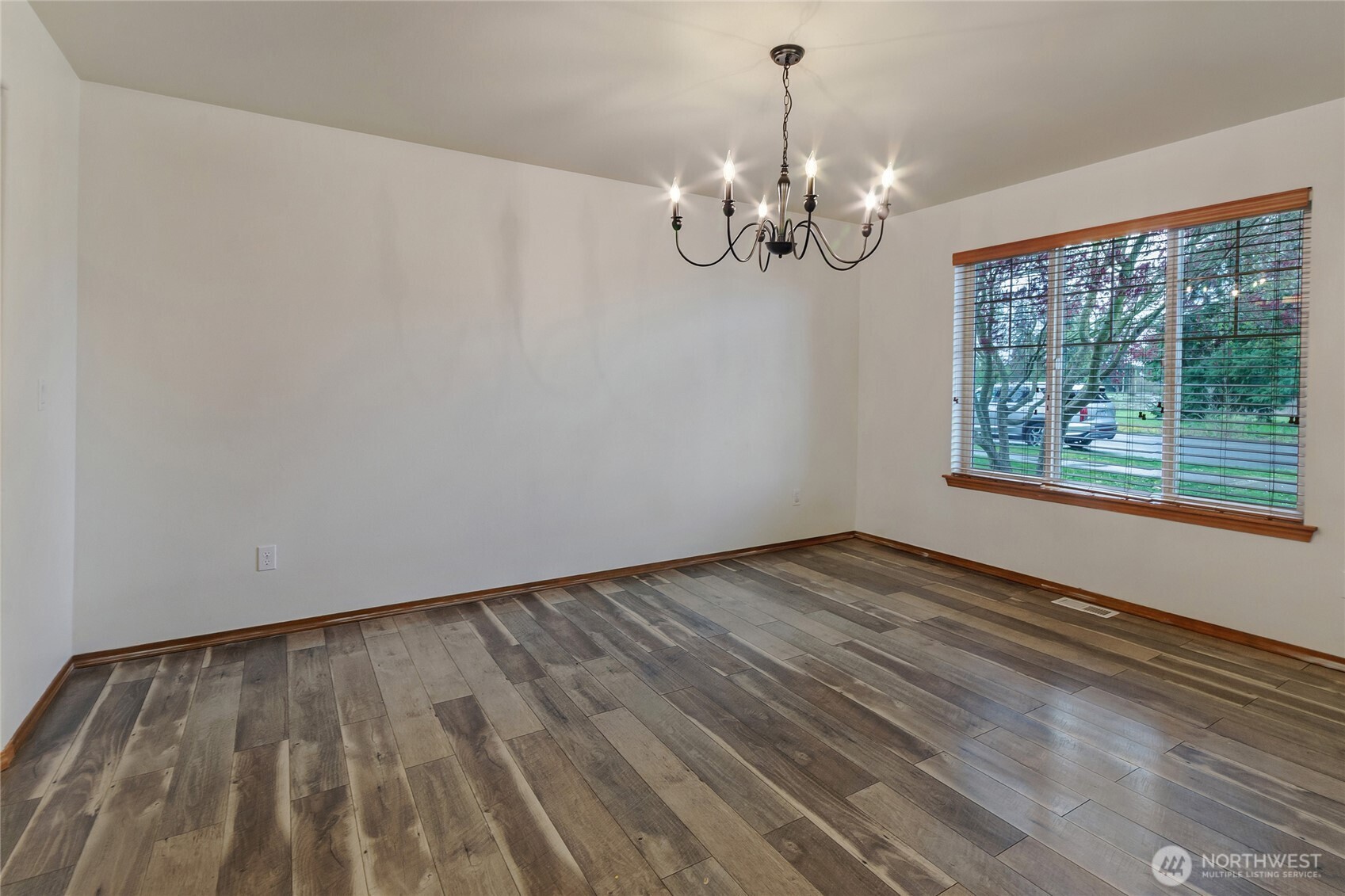 9114 Canal Road Southeast Yelm, WA 98597 - Photo 7 of 40 a view of empty room with wooden floor and fan