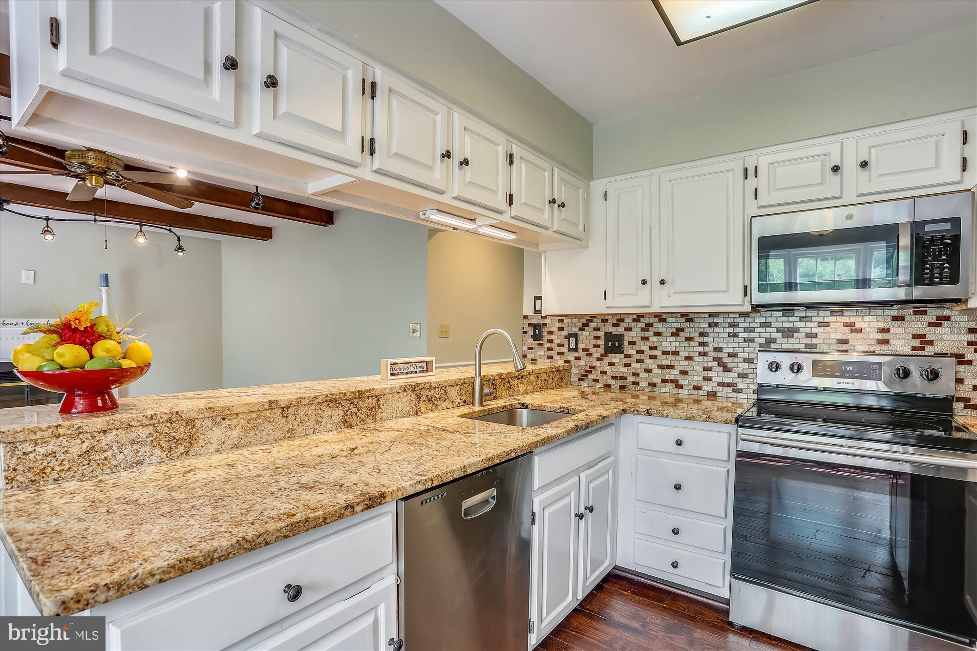 8908 Spring Berry Court Gaithersburg, MD 20886 - Photo 11 of 59 Kitchen with granite counter tops, breakfast bar