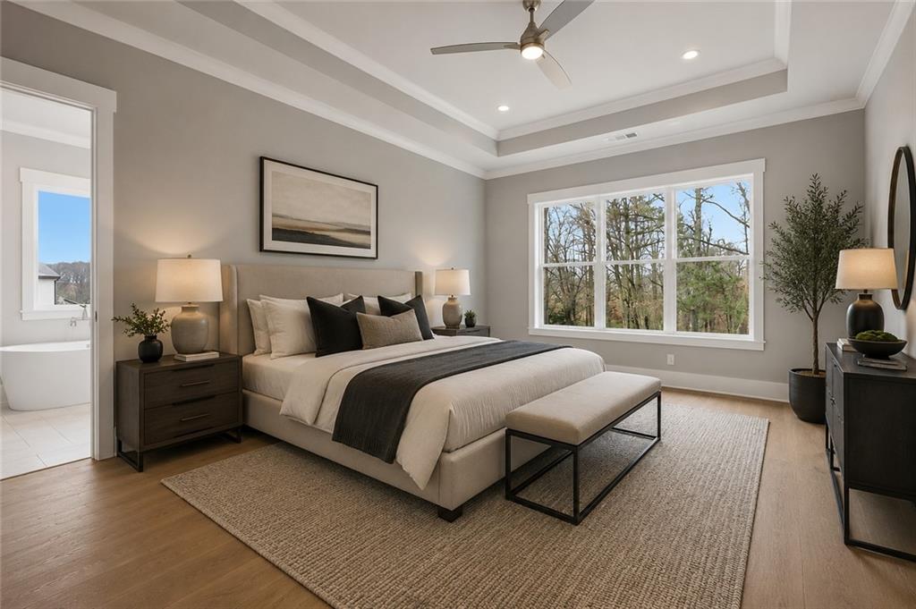 216 Ewing Way Dacula, GA 30019 - Photo 7 of 80 a bedroom with a bed and wooden floor