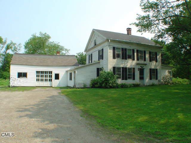 50 Cunningham Road Warren, CT 06754 - Photo 1 of 1 a front view of a house with a garden