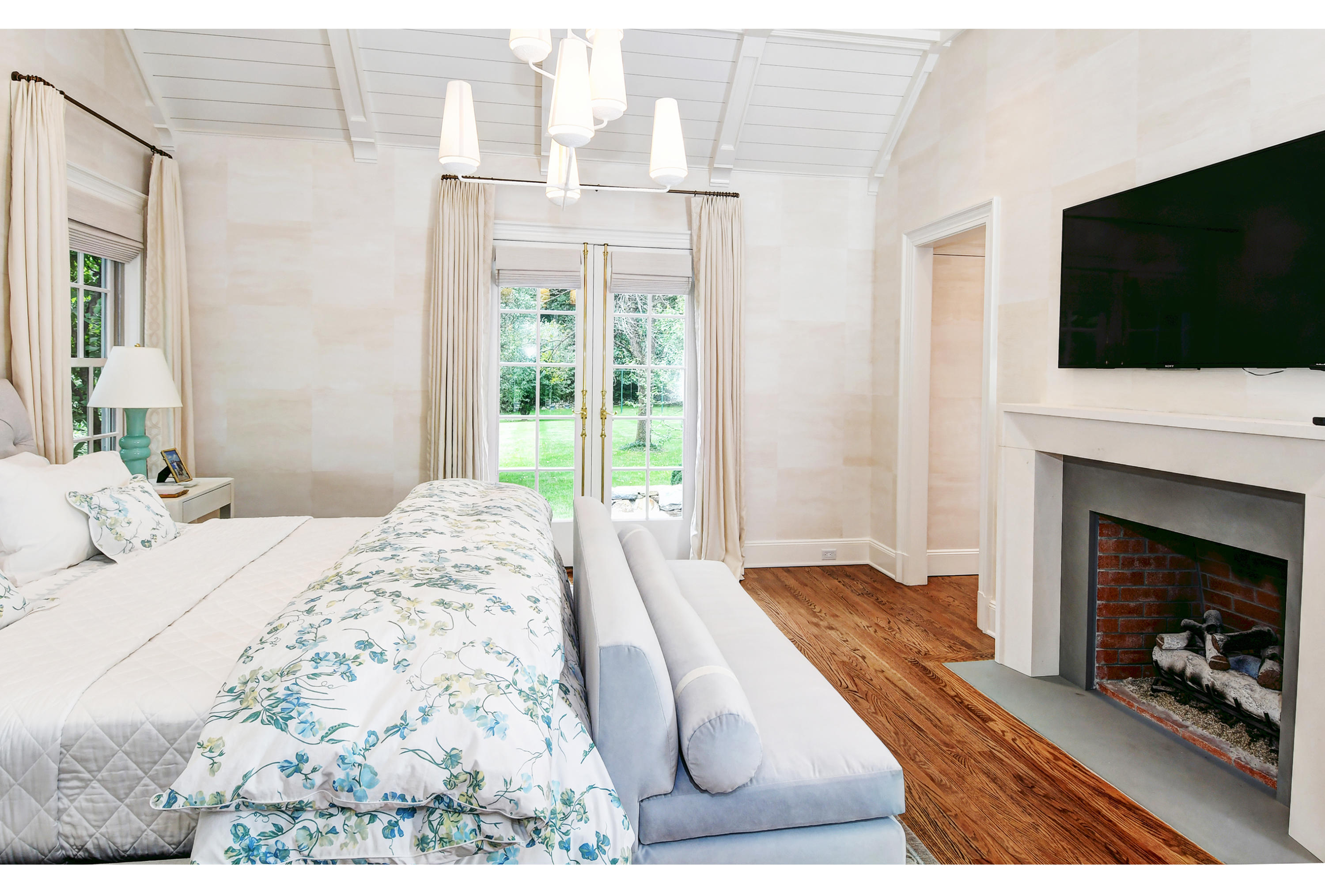 507 Silvermine Road New Canaan, CT 06840 - Photo 23 of 40 a bedroom with a bed and a flat screen tv