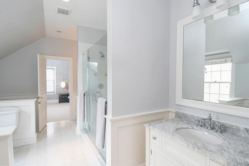 507 Silvermine Road New Canaan, CT 06840 - Photo 32 of 40 a en suite bathroom with a granite countertop sink and a mirror