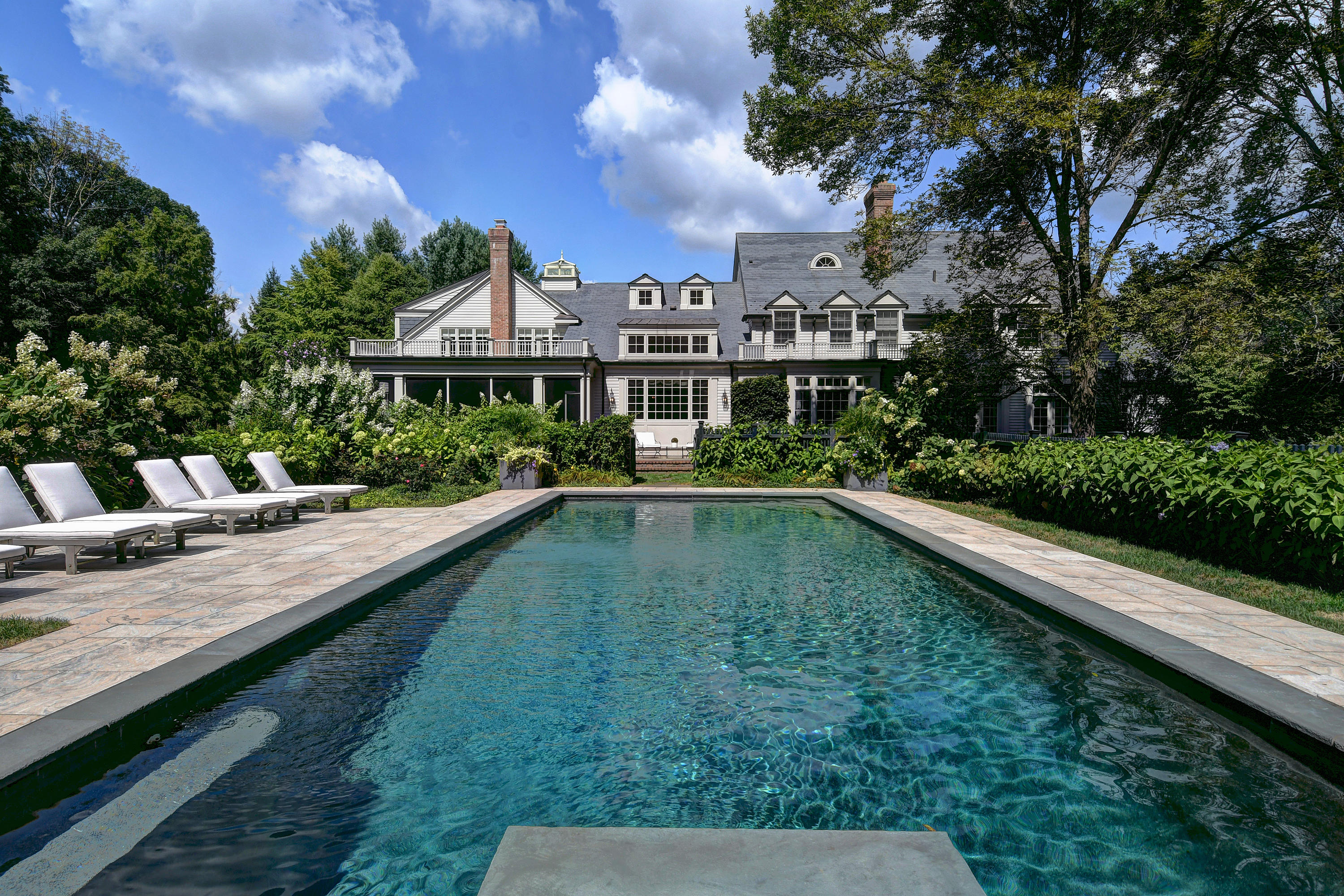 507 Silvermine Road New Canaan, CT 06840 - Photo 5 of 40 a view of a house with swimming pool