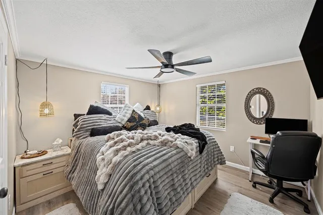 a bedroom with bed and a window