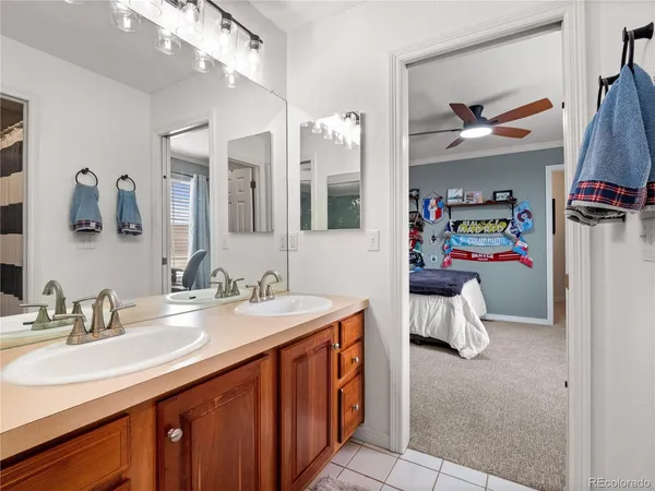 a bathroom with a sink double vanity and a mirror