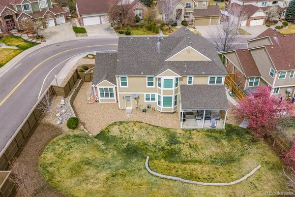 an aerial view of a house with swimming pool