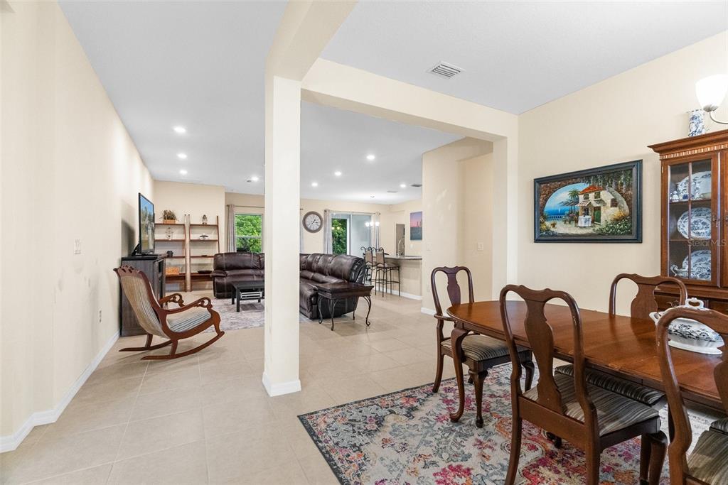 6283 Grapewood Road Spring Hill, FL 34609 - Photo 8 of 41 a view of a dining room with furniture and a rug