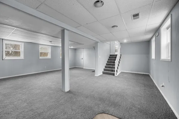 a view of room with stairs and a window