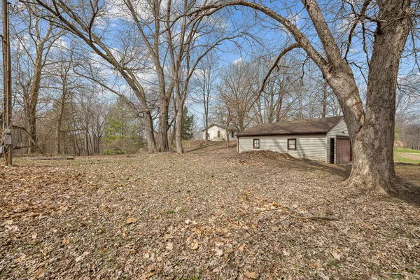 a view of house that has a tree