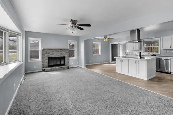 a view of a kitchen with a stove cabinets and a fireplace
