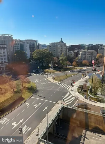 a living room with furniture and a lamp