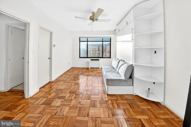 a bedroom with a bed and a mirror