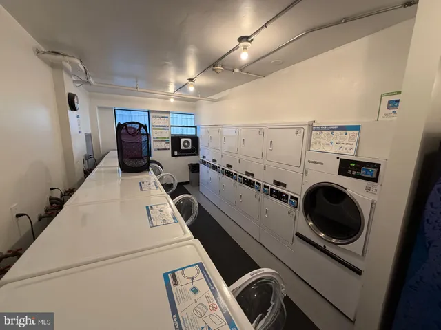 a room with lots of books and a fireplace