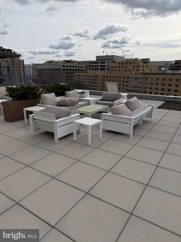 a city street with tall buildings in the background