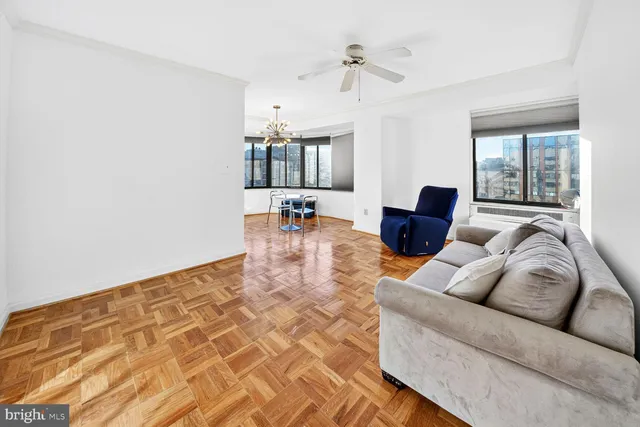 a kitchen with stainless steel appliances granite countertop a sink a stove a refrigerator a washer dryer and white cabinets