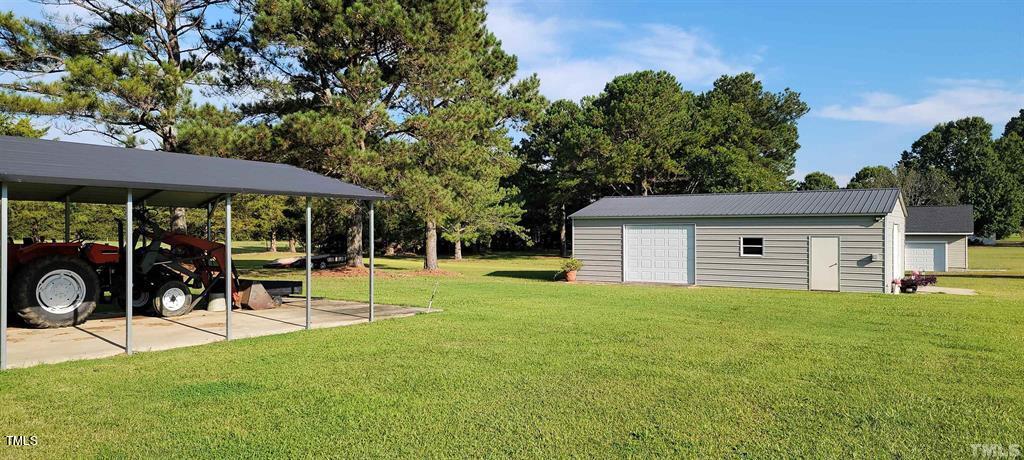2891 Benson Hardee Road Benson, NC 27504 - Photo 19 of 51 Check out this Man Cave/Barn, Covered Pad with parking shelter is perfect for your tractor, extra Truck or Toy!