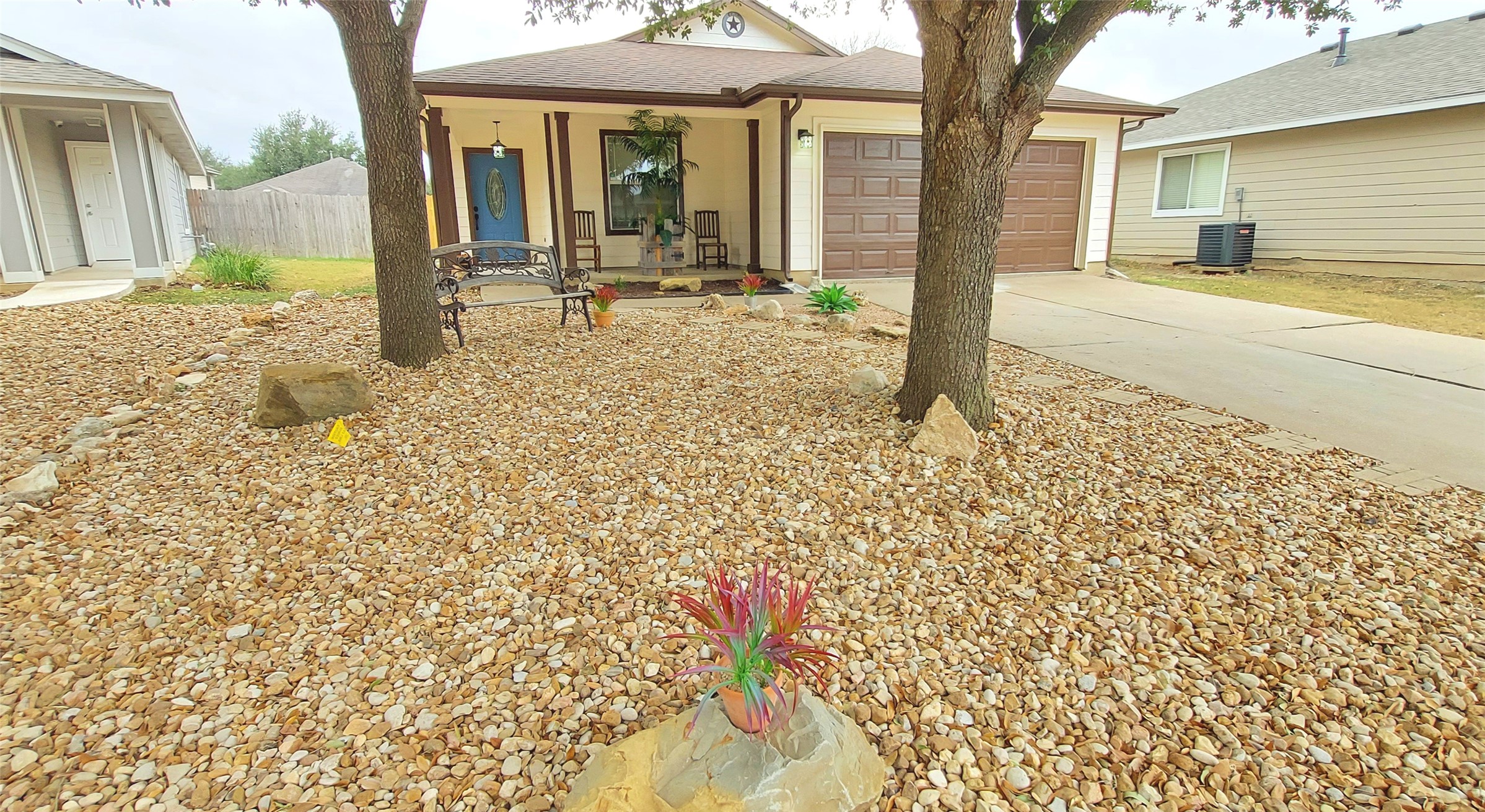 17609 Soapberry Cove Elgin, TX 78621 - Photo 1 of 38 a backyard of a house with table and chairs