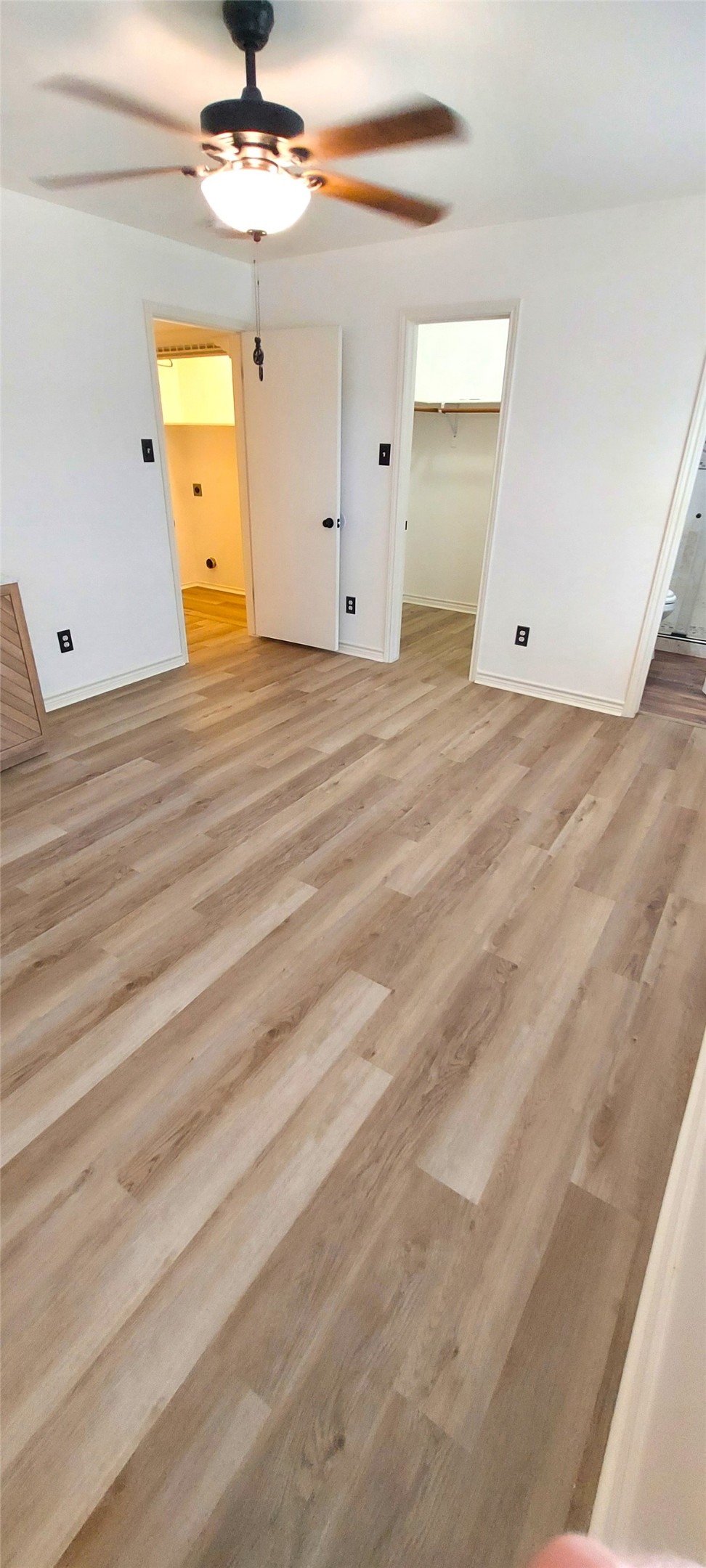 17609 Soapberry Cove Elgin, TX 78621 - Photo 18 of 38 a view of a room with wooden floor
