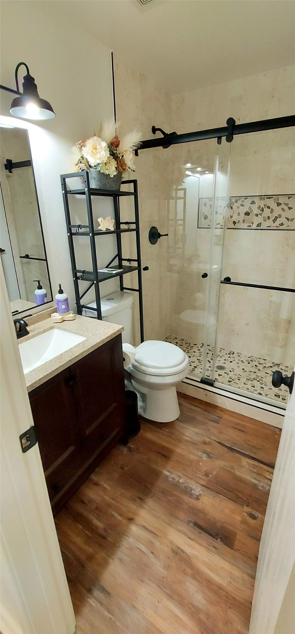17609 Soapberry Cove Elgin, TX 78621 - Photo 20 of 38 a bathroom with a sink toilet and shower