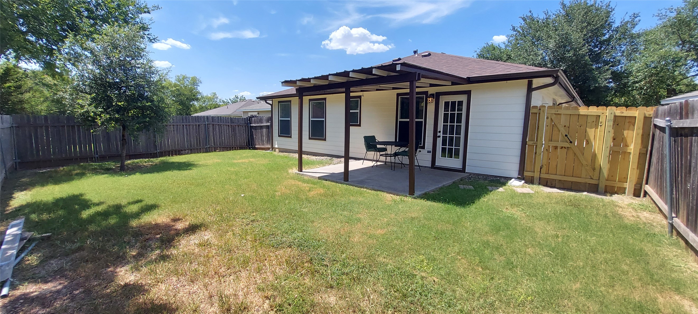 17609 Soapberry Cove Elgin, TX 78621 - Photo 31 of 38 a view of a house with a yard and furniture
