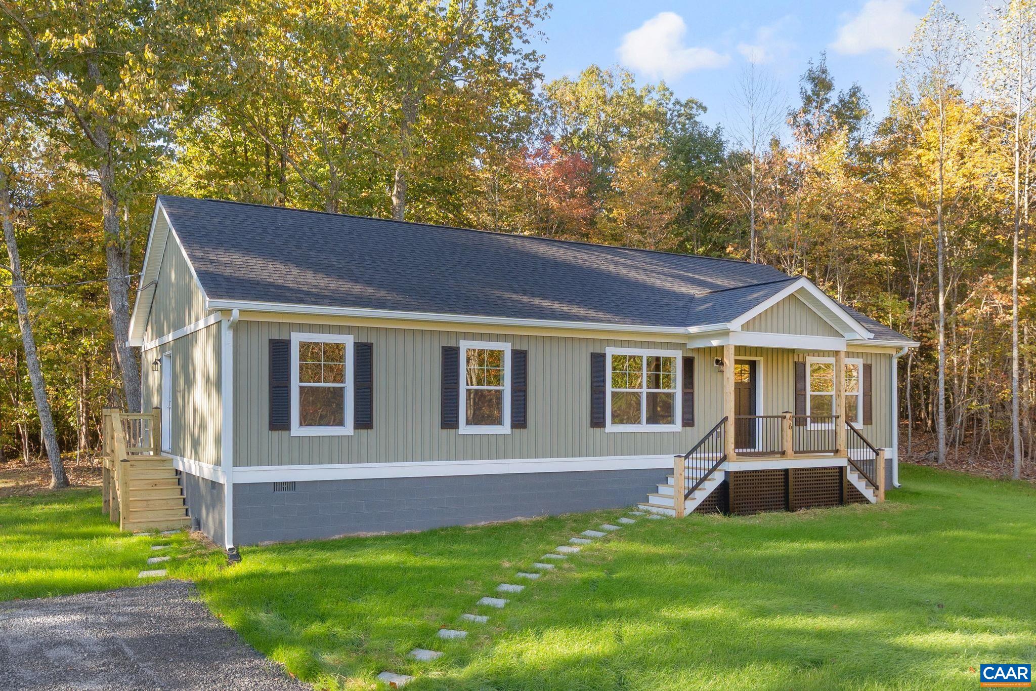 a view of a house with a yard