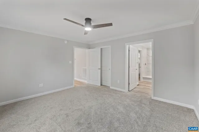a bedroom with bed and a flat screen tv