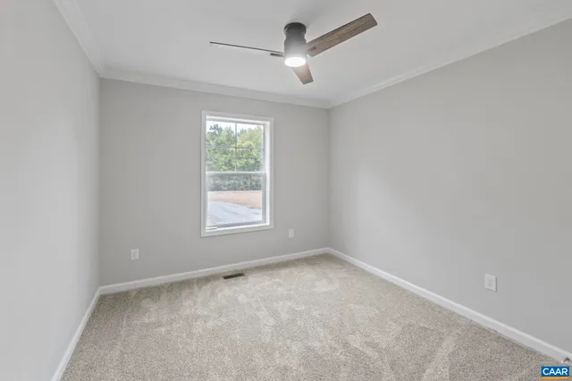 a view of backyard with a garden and trees