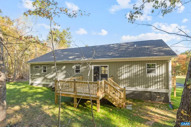 a view of a city with lush green forest