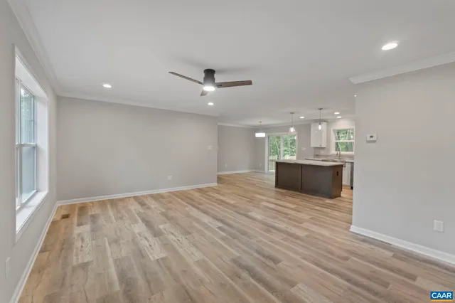 a view of a kitchen with a sink and a window