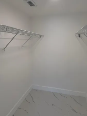 a view of an empty walk in closet