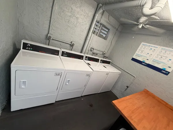 a view of a kitchen from the hallway