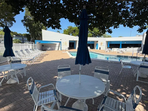 a view of a swimming pool with a lounge chairs