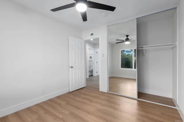 a bathroom with a toilet a sink and a mirror