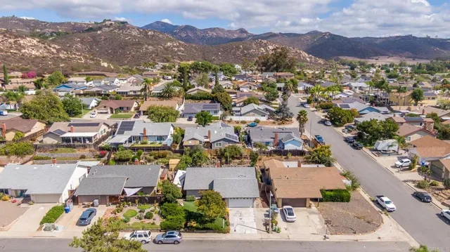 an aerial view of residential houses with outdoor space