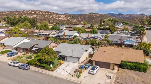 an aerial view of a city with lots of residential buildings