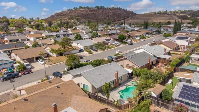 an aerial view of residential houses with outdoor space