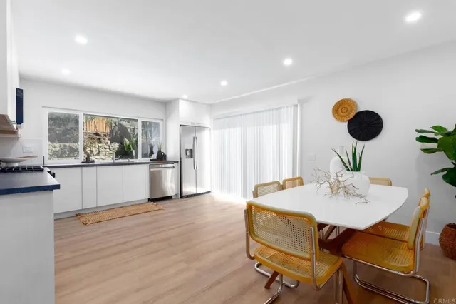 a kitchen with a table and chairs in it