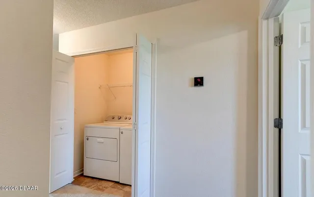 a view of a hallway with closet