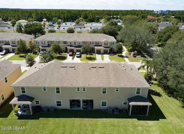 a aerial view of a house with a swimming pool