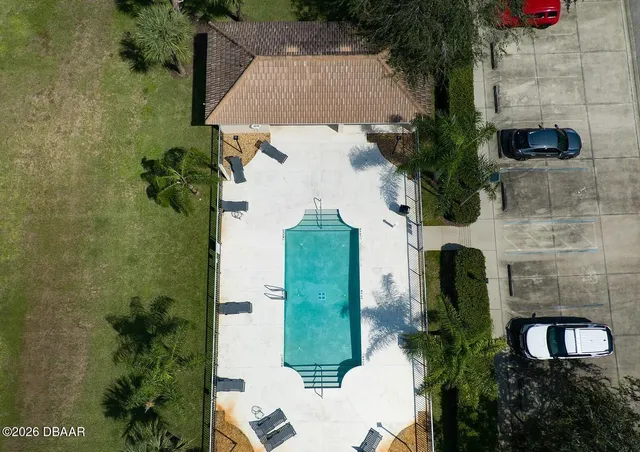 an aerial view of a house with a garden