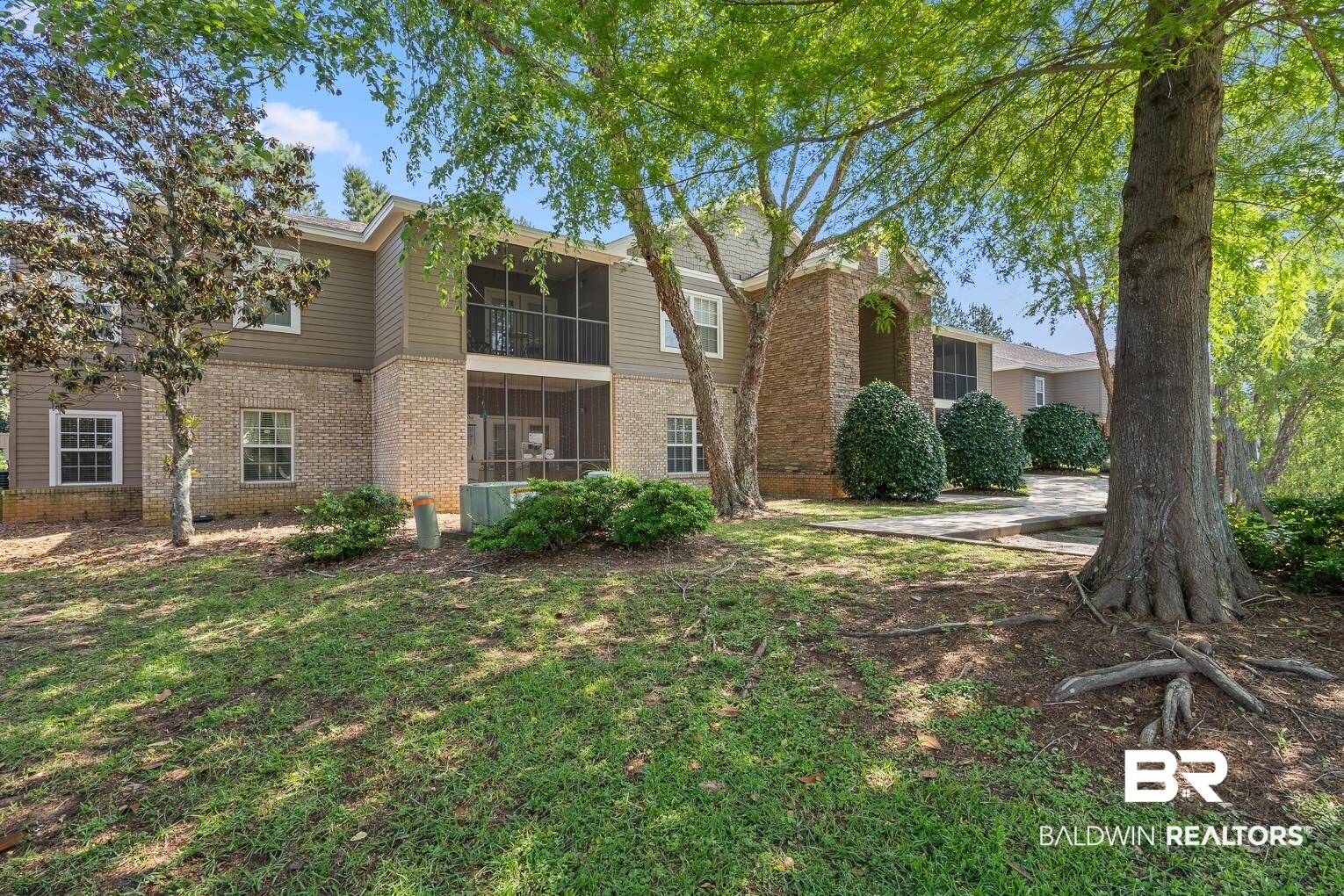 450 Park Avenue, Unit 112 Foley, AL 36535 - Photo 6 of 20 Traditional-style home with brick siding and a sunroom