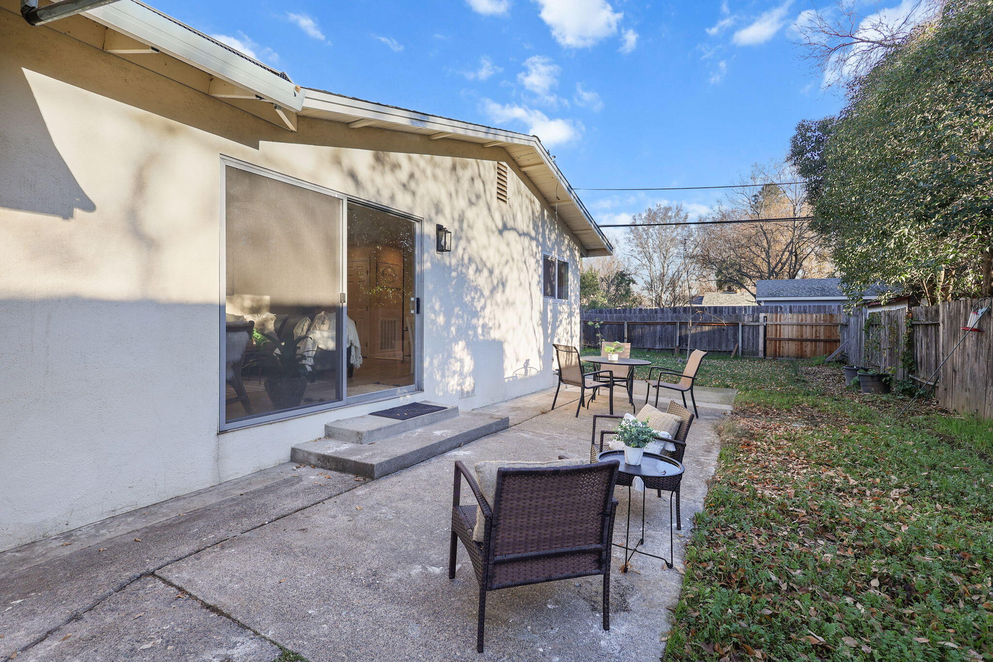 755 Christine Avenue Redding, CA 96003 - Photo 11 of 58 a view of a backyard with sitting area and furniture